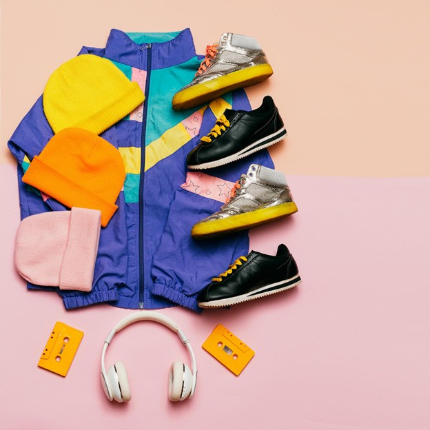 Colorful sportswear paired with headphones, showcasing hipster style and unique custom apparel for a retro-modern look.